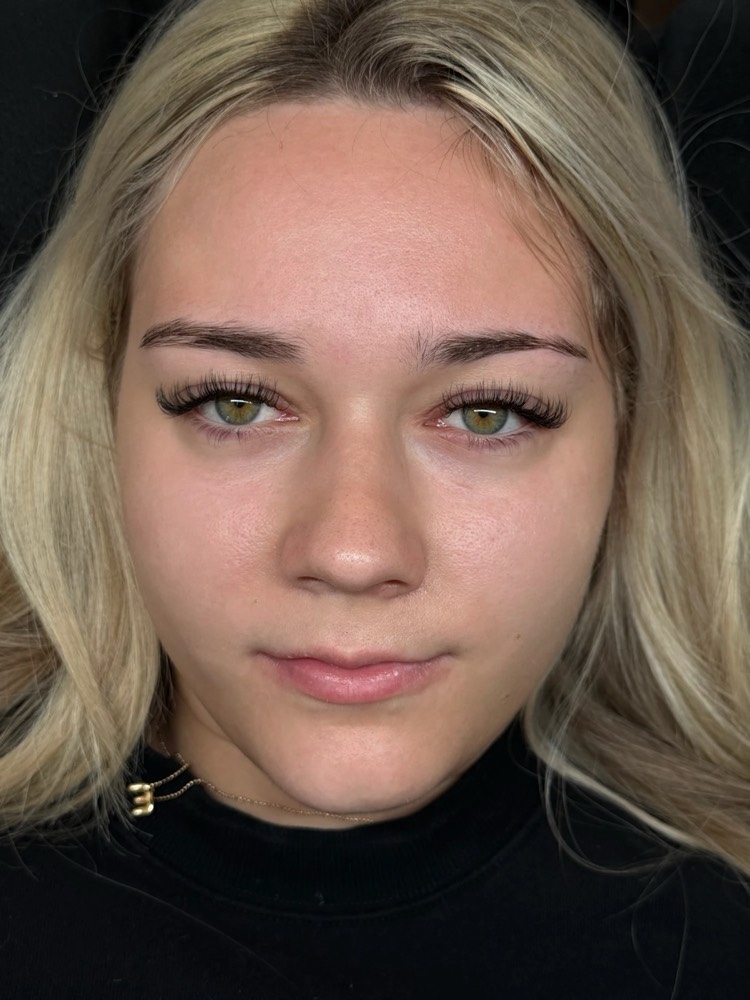 Natural full lash set enhancing both eyes